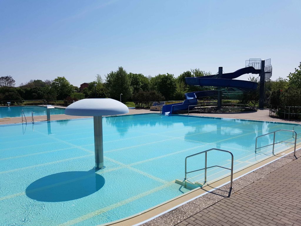 Swimming pool with slide