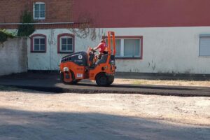 Employees of a specialist company lay asphalt